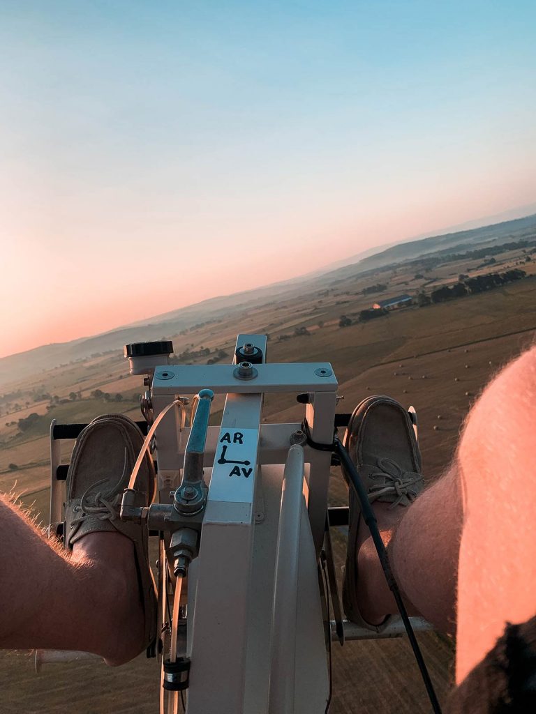 Feet on the Microlight in Coltines, France. Flying with the birds