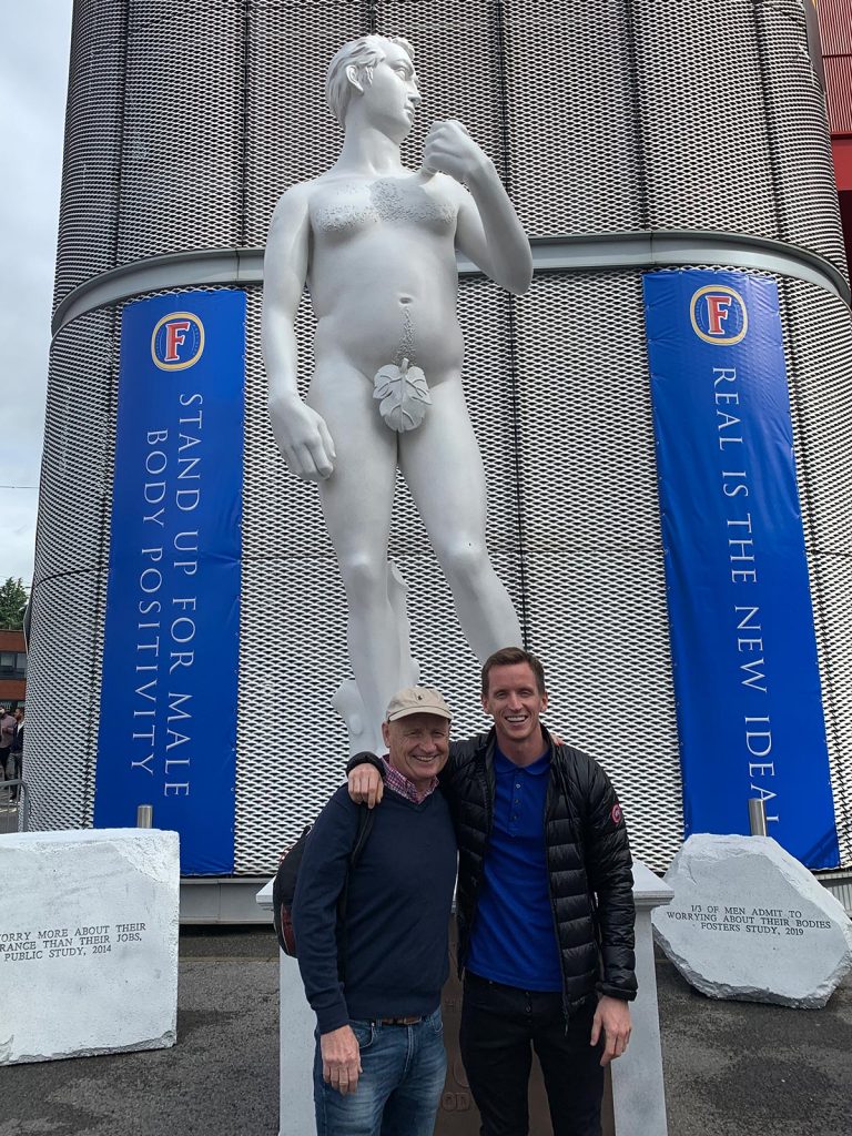 David Simpson and dad beside statue in Trafford, England. The ashes, 2019