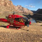 David Simpson and helicopter in Grand Canyon, USA. Helicopter tour over the Grand Canyon