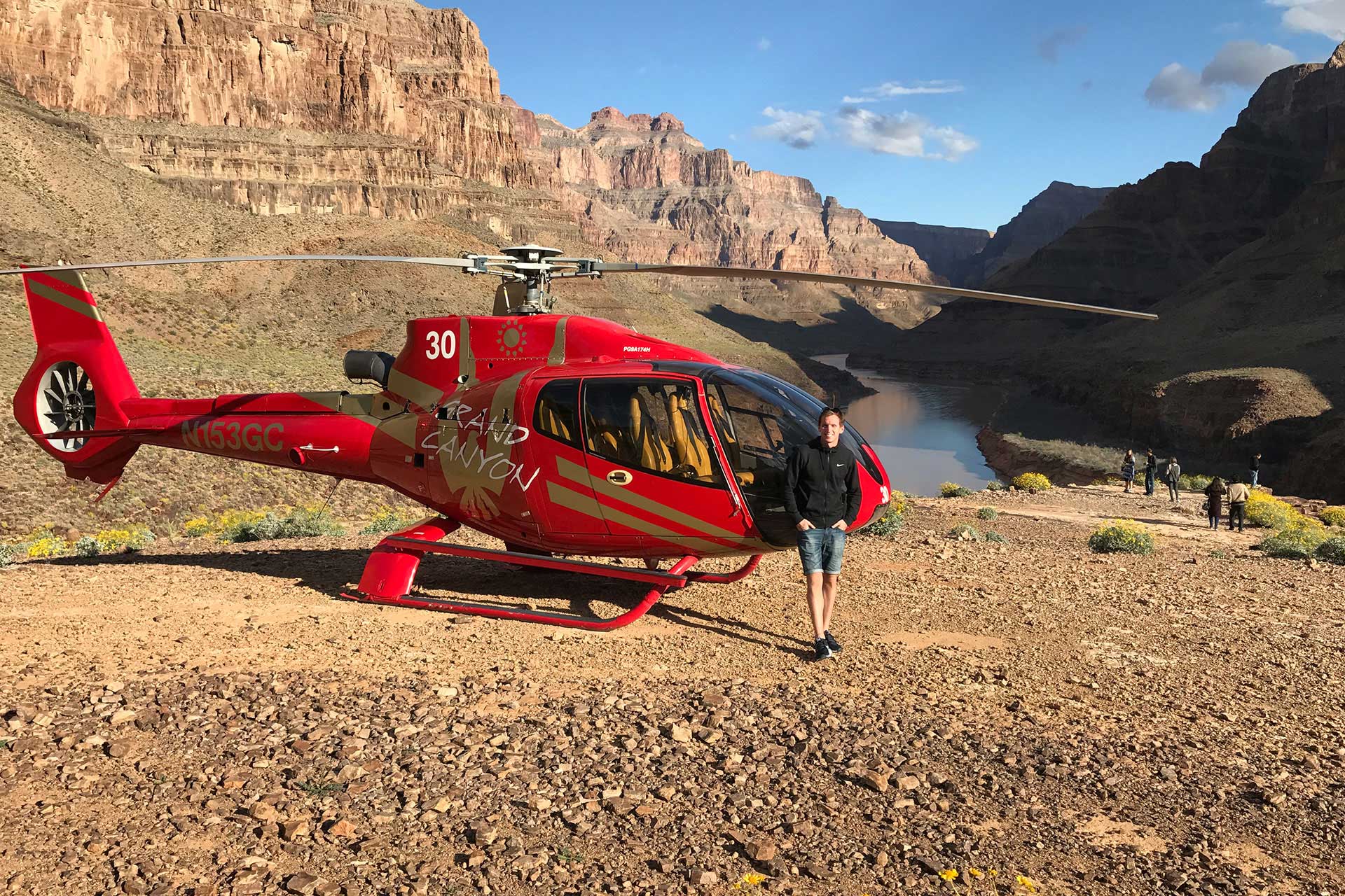 David Simpson and helicopter in Grand Canyon, USA. Helicopter tour over the Grand Canyon