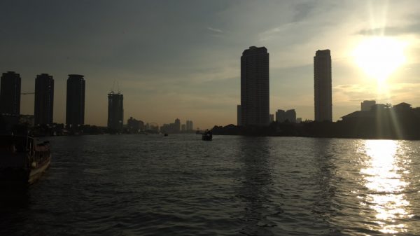 Sunset at Chao Phraya River in Bangkok, Thailand. Getting scammed in Bangkok