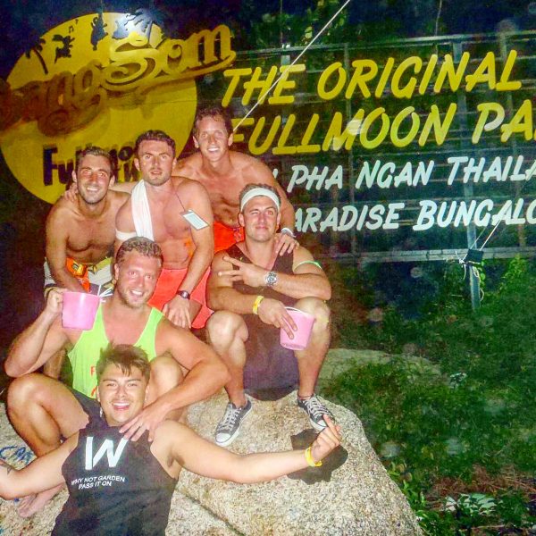 David Simpson and the gang infront of SangSom sign in Thailand. New years full moon party