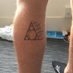 A tattooed leg in Abel Tasman, New Zealand, New Zealand. Wellington & Abel Tasman