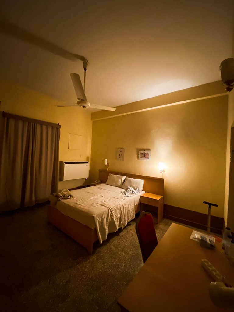 Bedroom accommodation at Acropole Hotel in Sudan. Getting caught up in a protest in Sudan