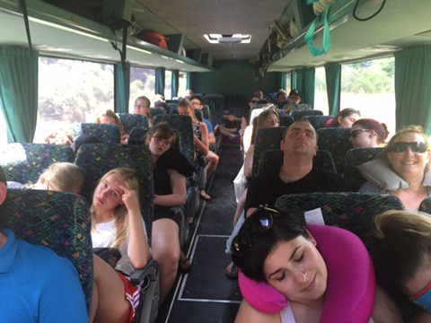 A busload on the way to Tongariro National Park in NZ. White water rafting and games at River valley