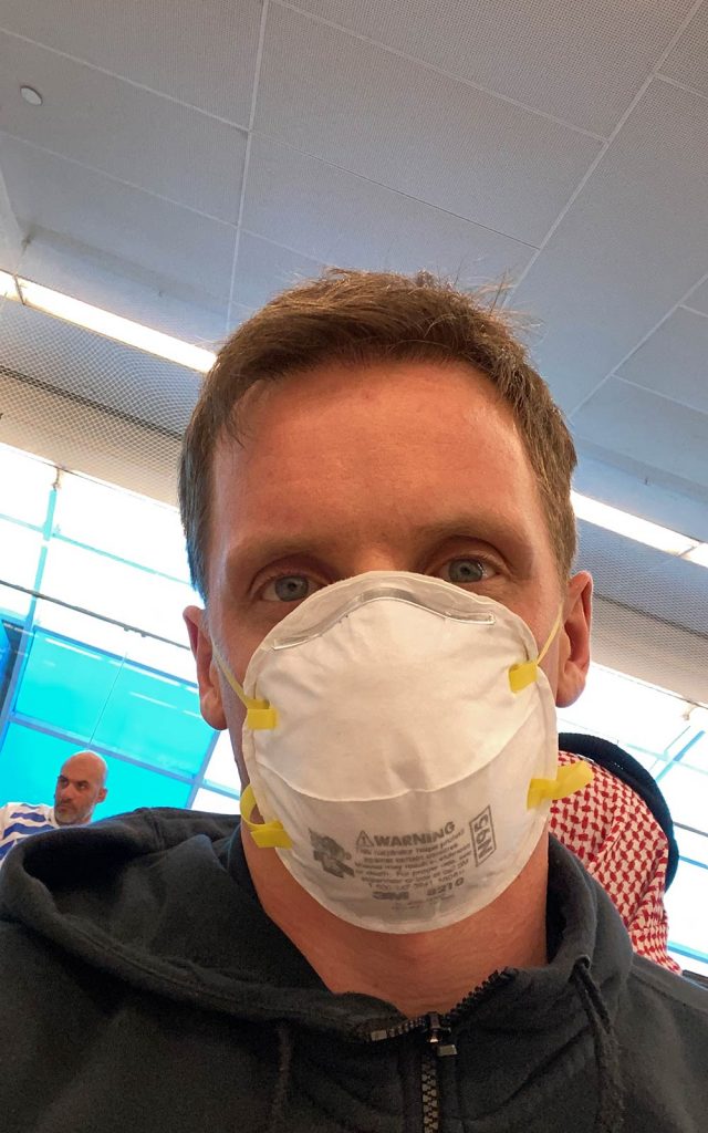 David Simpson wearing facemask at airport in Sharjah, UAE. An hour that made all the difference