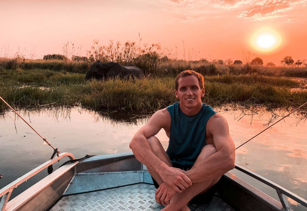 David Simpson and elephant at Okavango Delta in Botswana, Africa. An owl and African sunsets