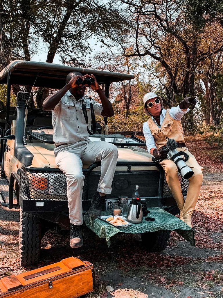 David Simpson and local guide seated in Botswana, Africa. The Southern Africa series reflection post