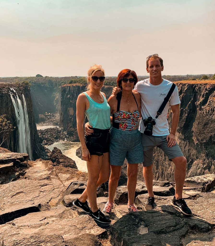 David Simpson and family at Victoria Falls in Zambia, Africa. The devil's pool