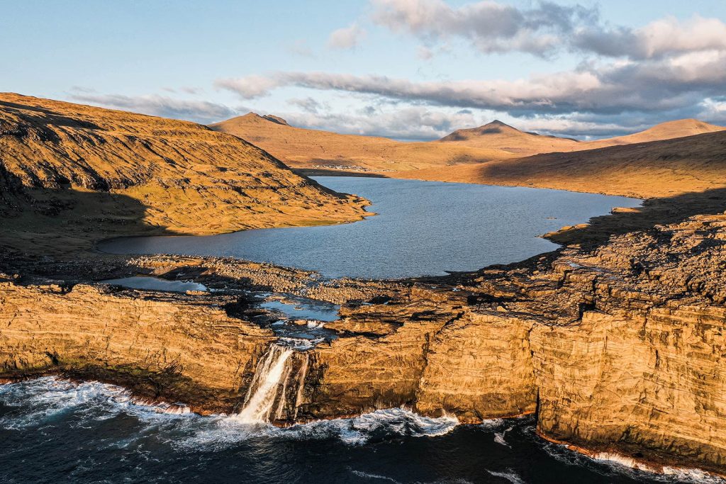 Trælanípa Slave Cliff and Leitisvatn Lake in Faroe Islands. The Faroe Islands has me