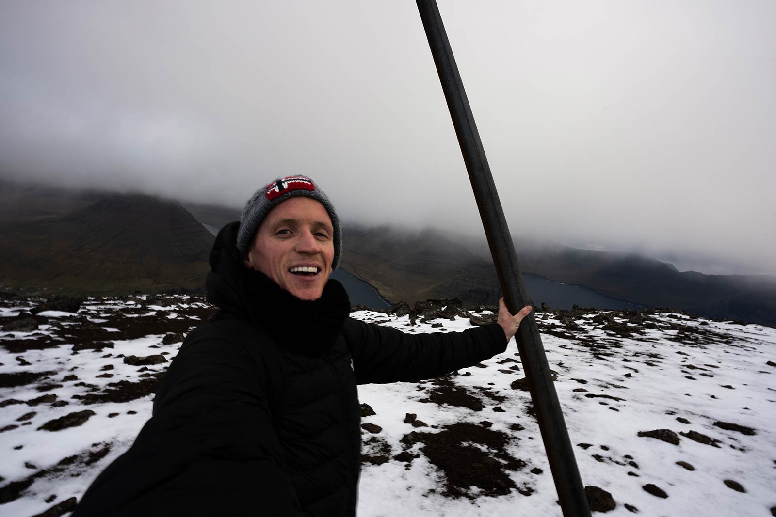 David Simpson at summit of Villingdalsfjall in Faroe Islands. Getting blown off Mt Villingardalsfjall