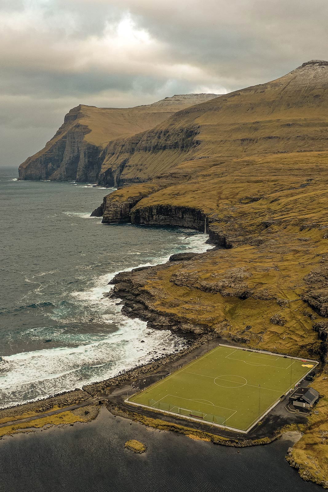 Football field at Gjogv in Faroe Islands. Full guide & itinerary for the Faroe Islands