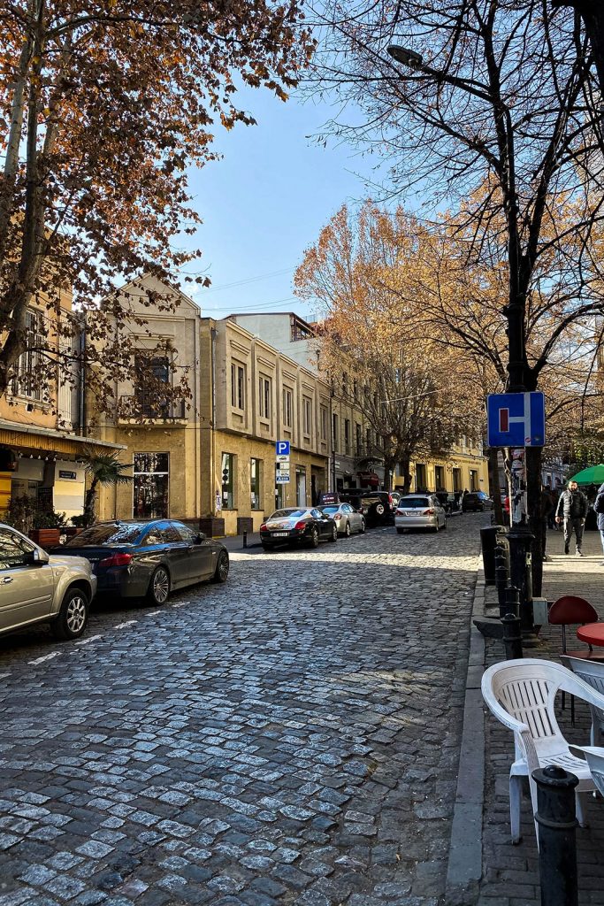Cobblestone street in Tbilisi, Georgia. Wine at Georgian immigration