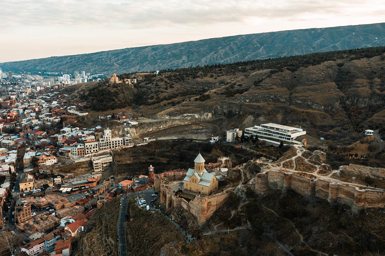 Birds eye view of Narikala Fortress in Tbilisi, Georgia. Wine at Georgian immigration