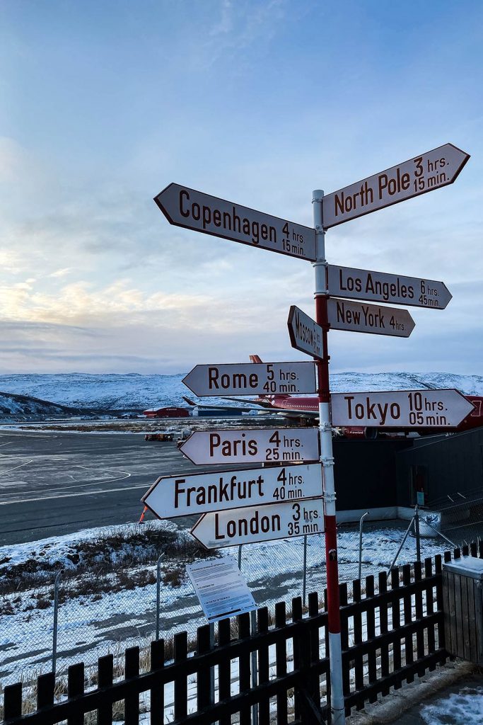 International direction signs in Greenland. The most scenic commercial flight in the world