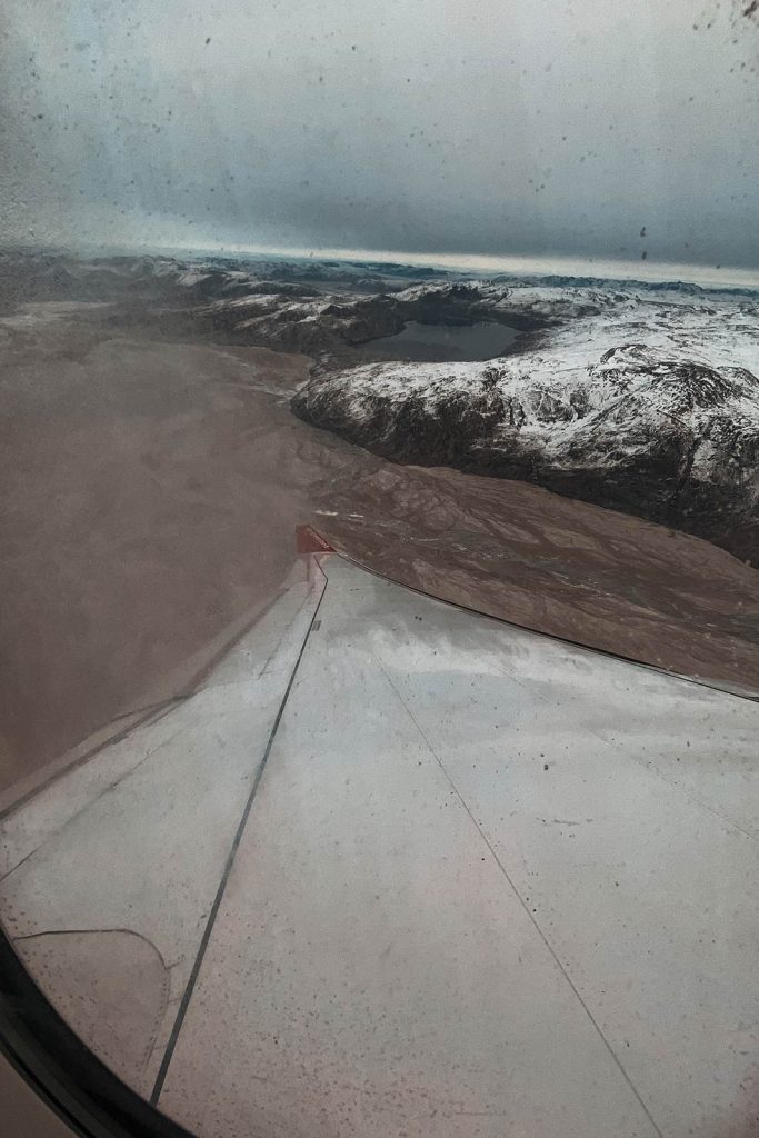 Plane window view of glacier and ice sheet in Kangerlussuaq, Greenland. Glacier, ice sheets & The Northern Lights