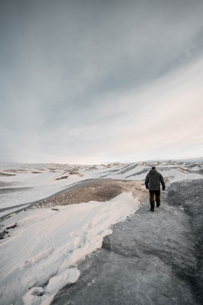 David Simpson walking the Ice Sheet in Kangerlussuaq, Greenland. Glacier, ice sheets & The Northern Lights