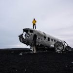 David Simpson on top of Sólheimasandur Plane Wreck in Iceland. From one paradise to another