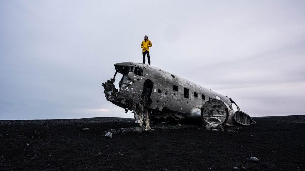 David Simpson on top of Sólheimasandur Plane Wreck in Iceland. From one paradise to another