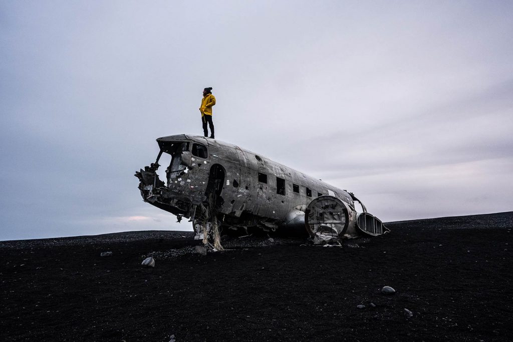 David Simpson on top of Sólheimasandur Plane Wreck in Iceland. The Nordic series, reflection post
