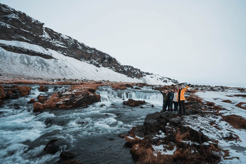 David Simpson and family at a River in Iceland. Waking up in a winter wonderland