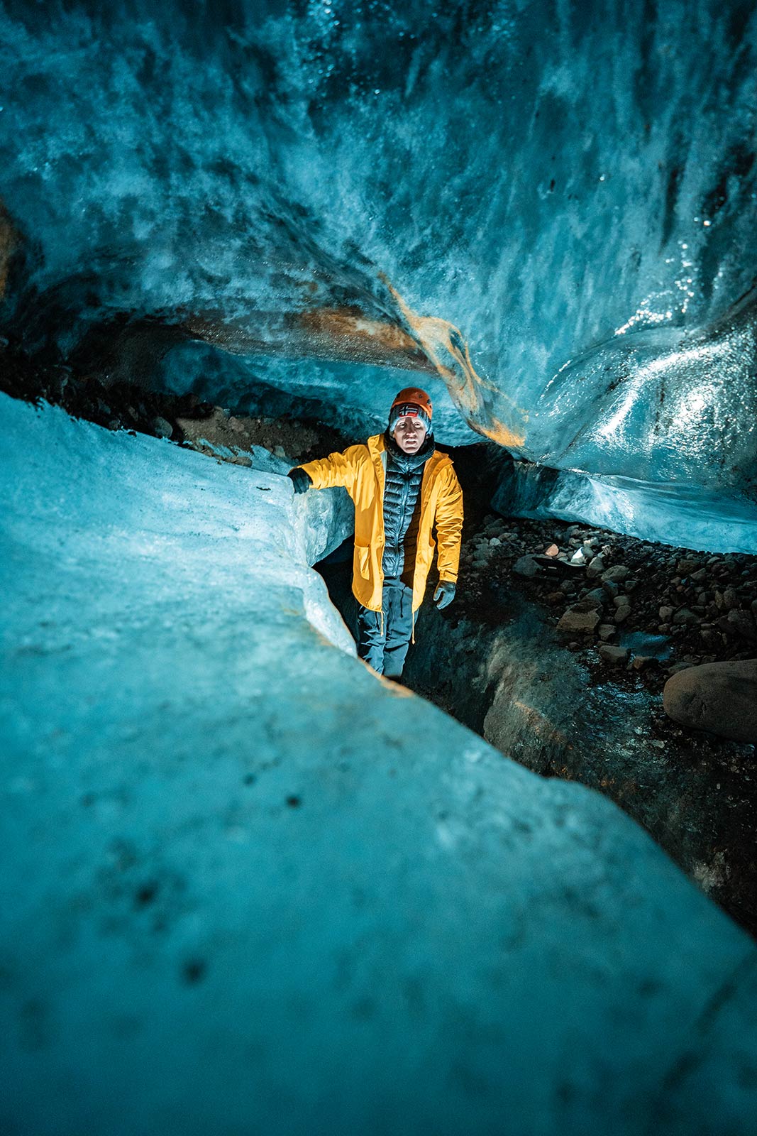 David Simpson inside cave at Skaftafellsjokul glacier in Iceland. Ice caving in Iceland