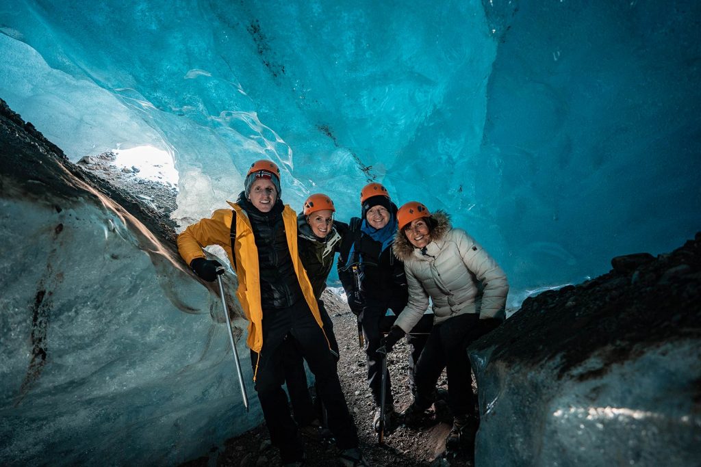 David Simpson and family inside Skaftafellsjokul glacier in Iceland. Ice caving in Iceland