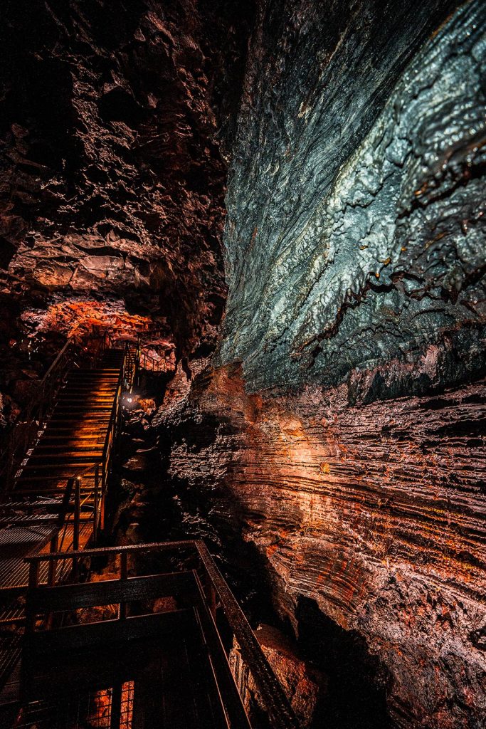 Inside Raufarhólshellir Lava Tunnel in Iceland. Diving between two tectonic plates