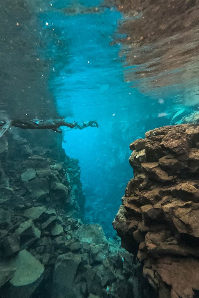 Diving at Silfra Fissure in Iceland. Diving between two tectonic plates