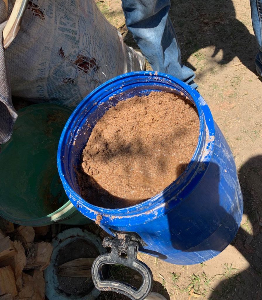 Livestock feed in a bucket in Lesotho, Africa. Getting drunk with the Maasai tribe in the Drakensberg
