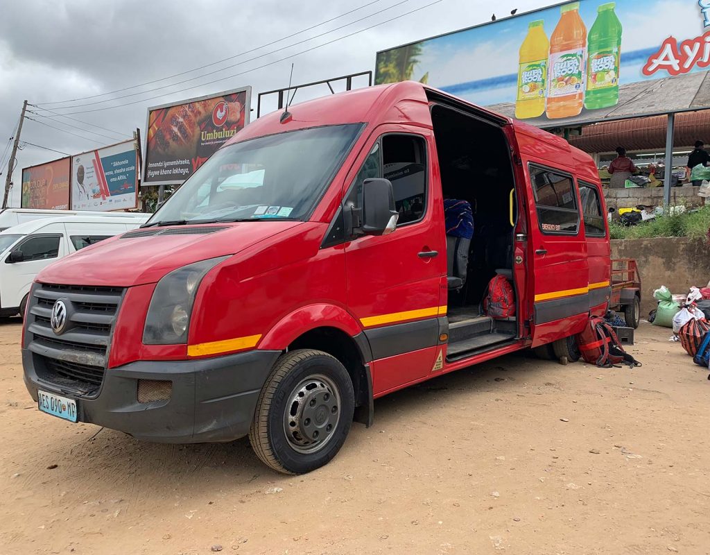 Red minivan in Manzini, Eswatini. The £4 bus that cost me £700