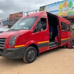 Red minivan in Manzini, Eswatini. The £4 bus that cost me £700