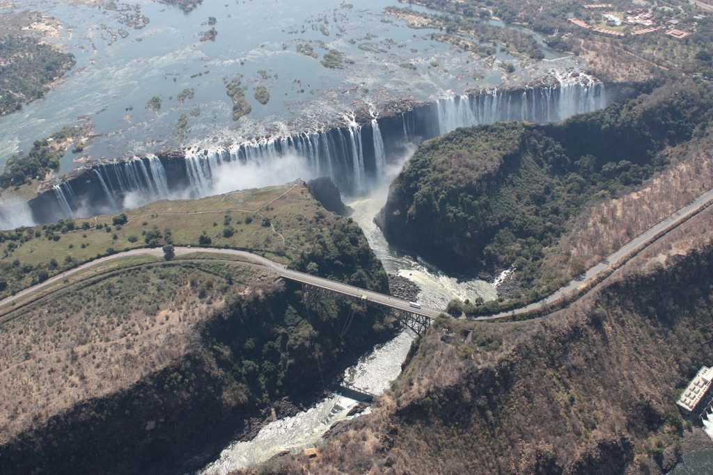 Birds eye view of Victoria Falls in Zambia, Africa. A bungee and a microlight over Victoria Falls