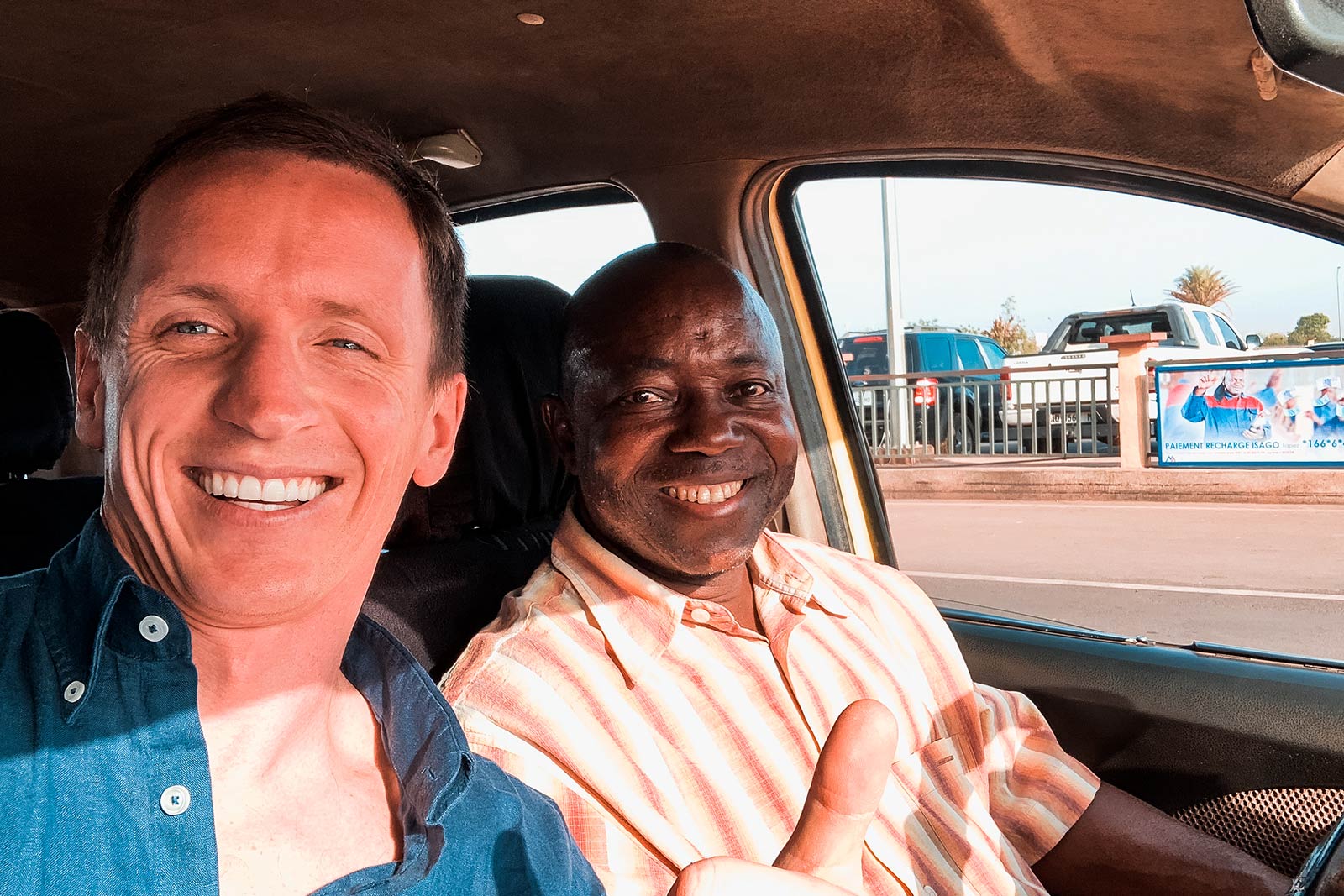 David Simpson and taxi driver in Bamako, Mali. A day in Bamako, Mali