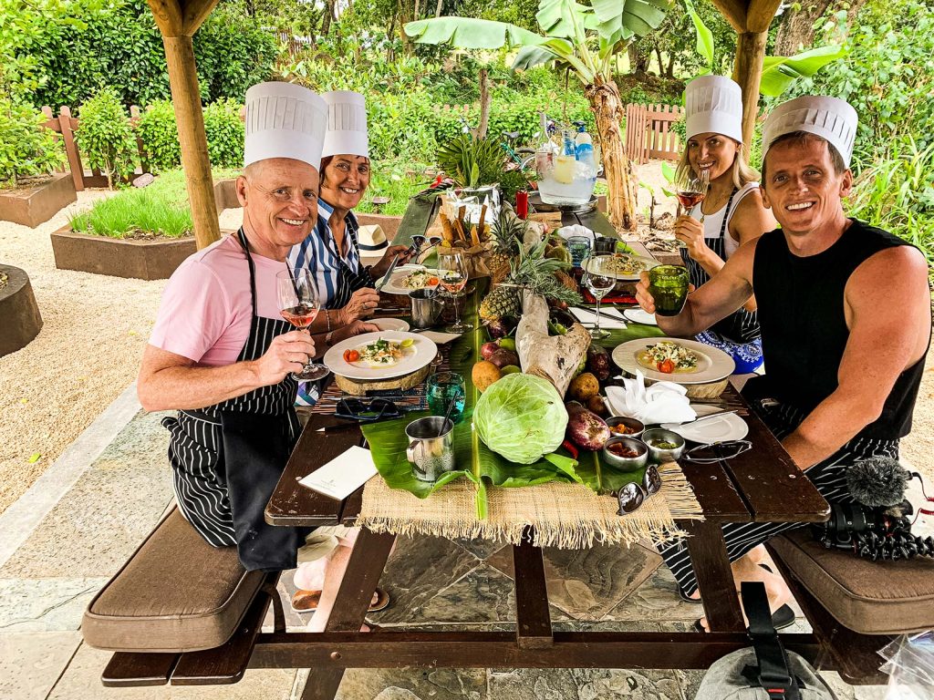 David Simpson and family eating at cookery school in Mauritius, Africa. Mauritian cookery class