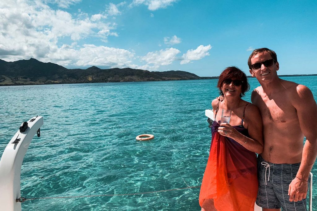 David Simpson and mom onboard catamaran in Mauritius, Africa. Sailing around Maritius
