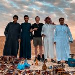 David Simpson drinking tea with locals at amphitheater in Saudi Arabia. A trip to the edge of the world