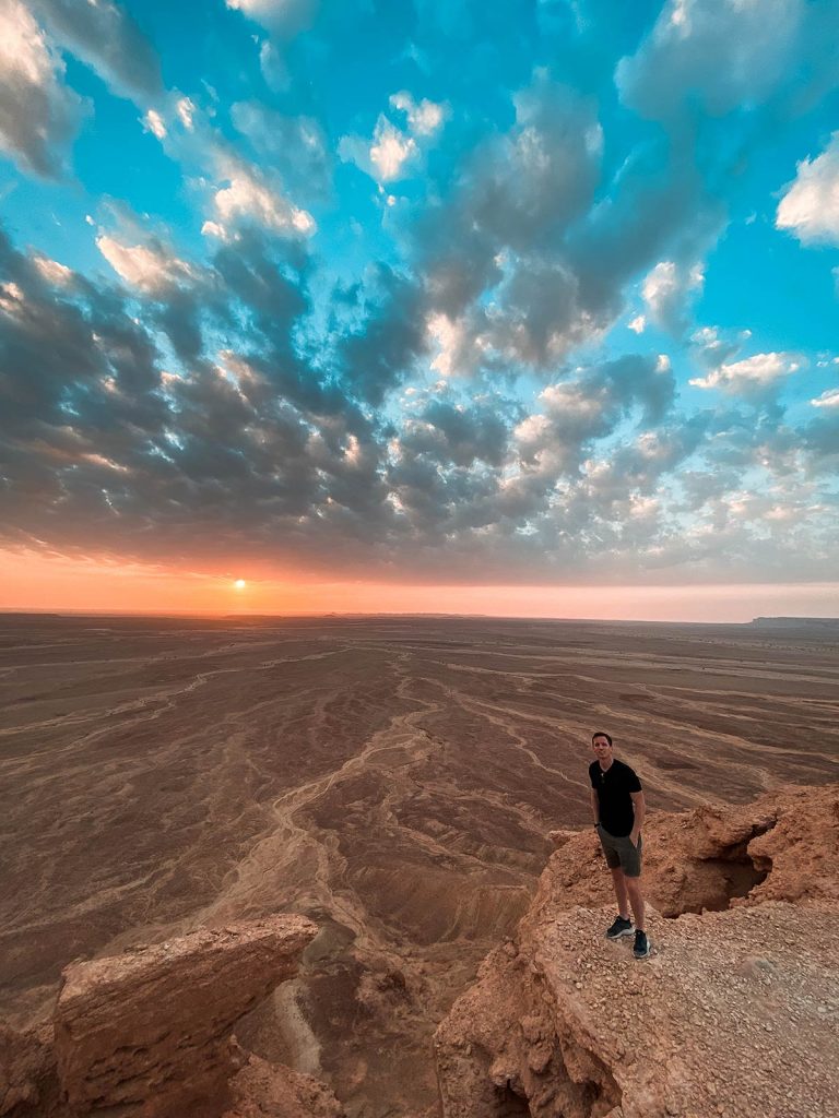 David Simpson during sunset at amphitheater in Saudi Arabia. A trip to the edge of the world
