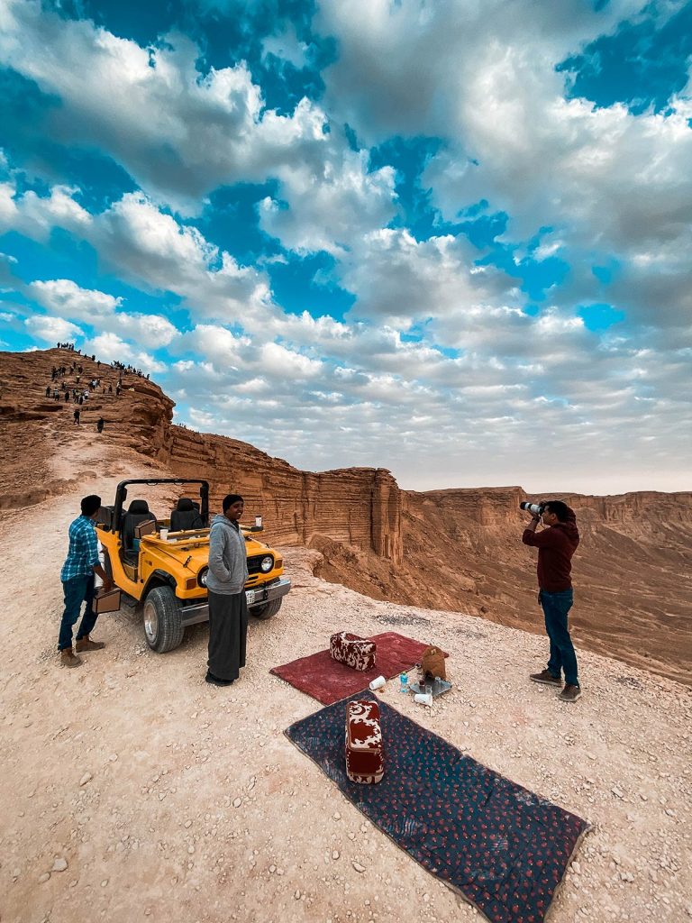 People in amphitheater in Saudi Arabia. A trip to the edge of the world