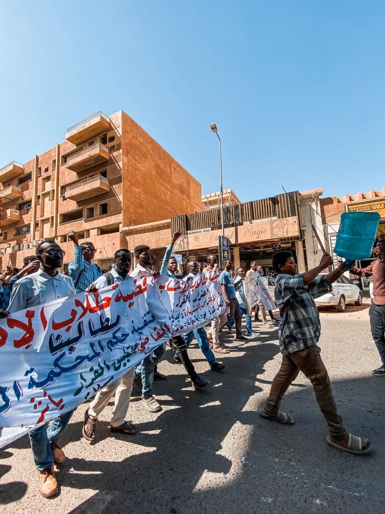 Protesters walking the street in Sudan. Getting caught up in a protest in Sudan