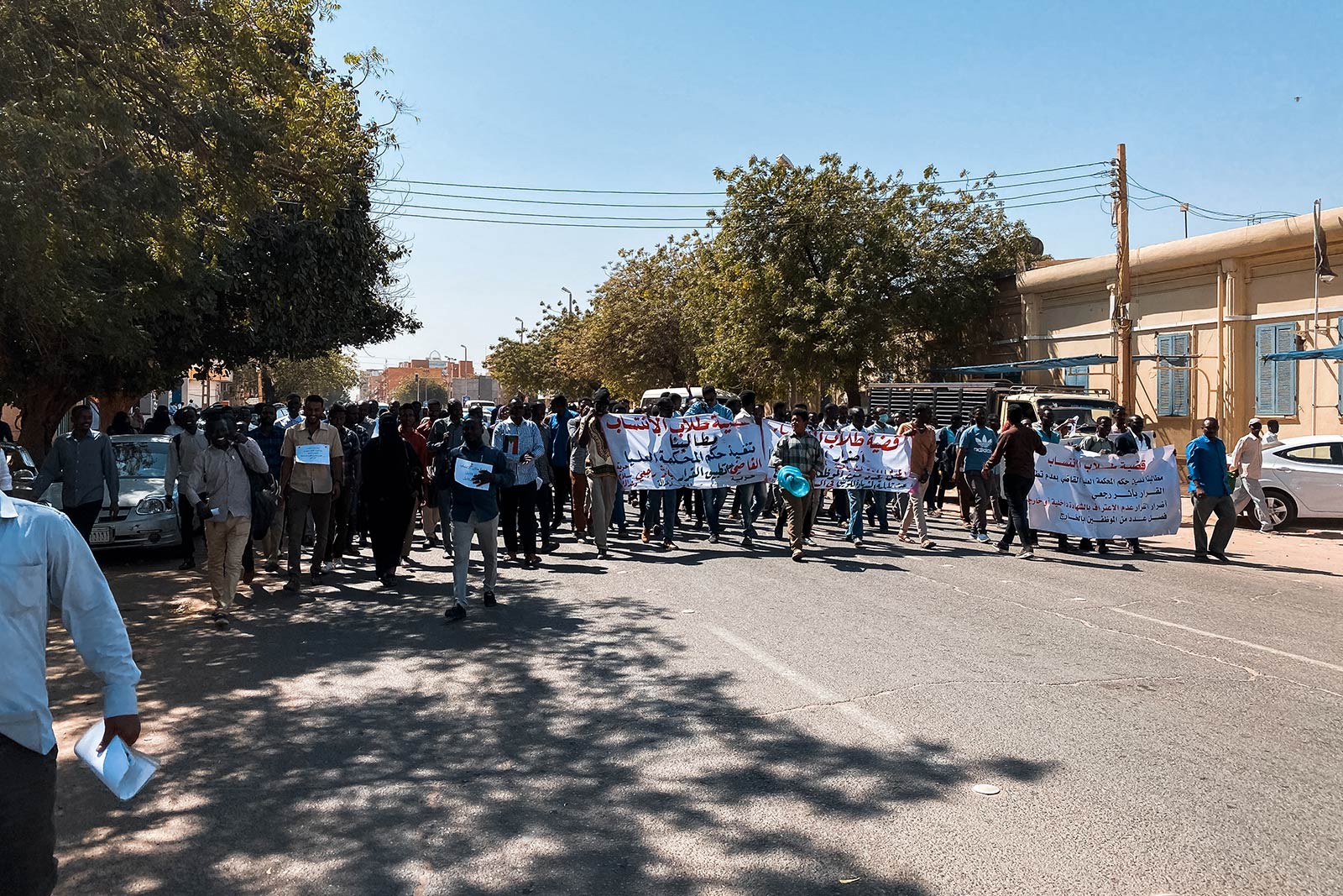 Protesters walking the street in Sudan. Getting caught up in a protest in Sudan