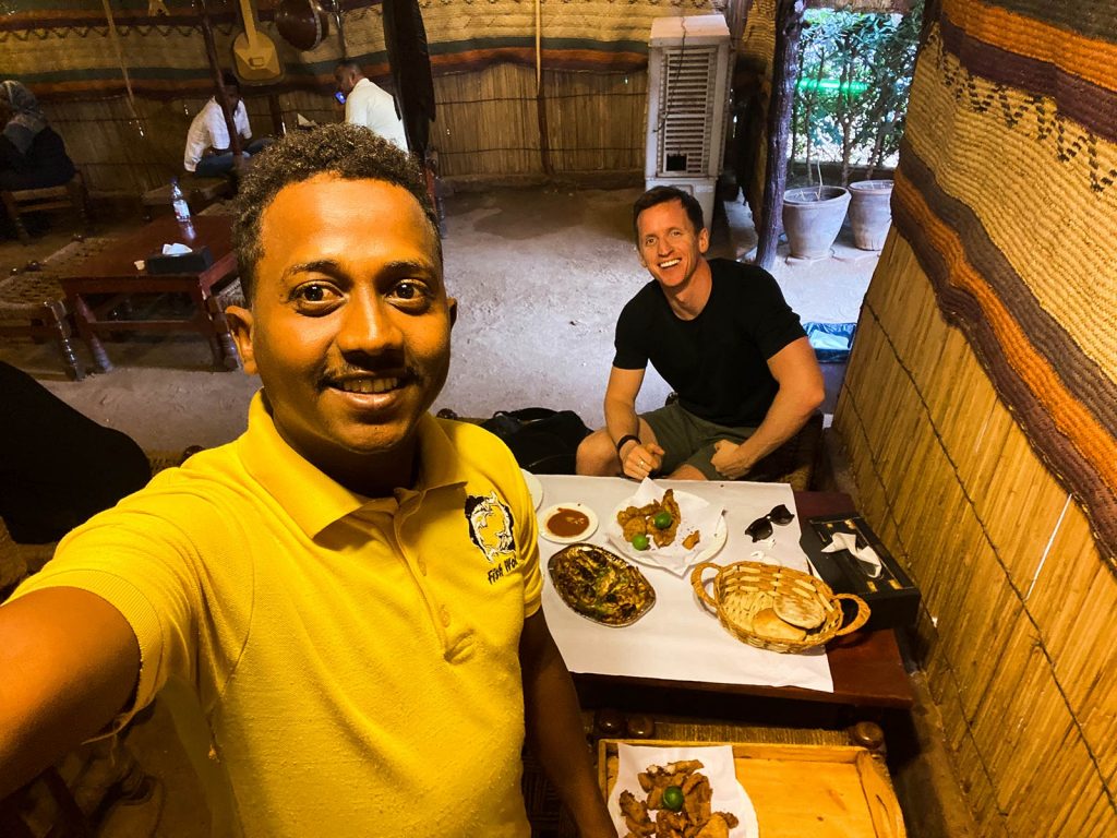 David Simpson and local guy at Fish Wok Restaurant in Sudan. The best fish & learning English