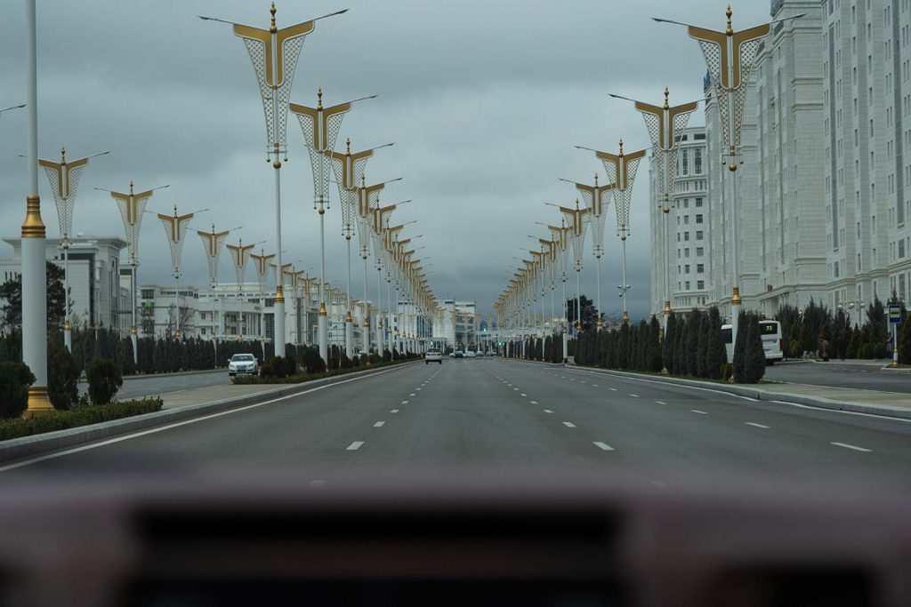Wide highway in Ashgabat, Turkmenistan. Confused taxis and pick ups