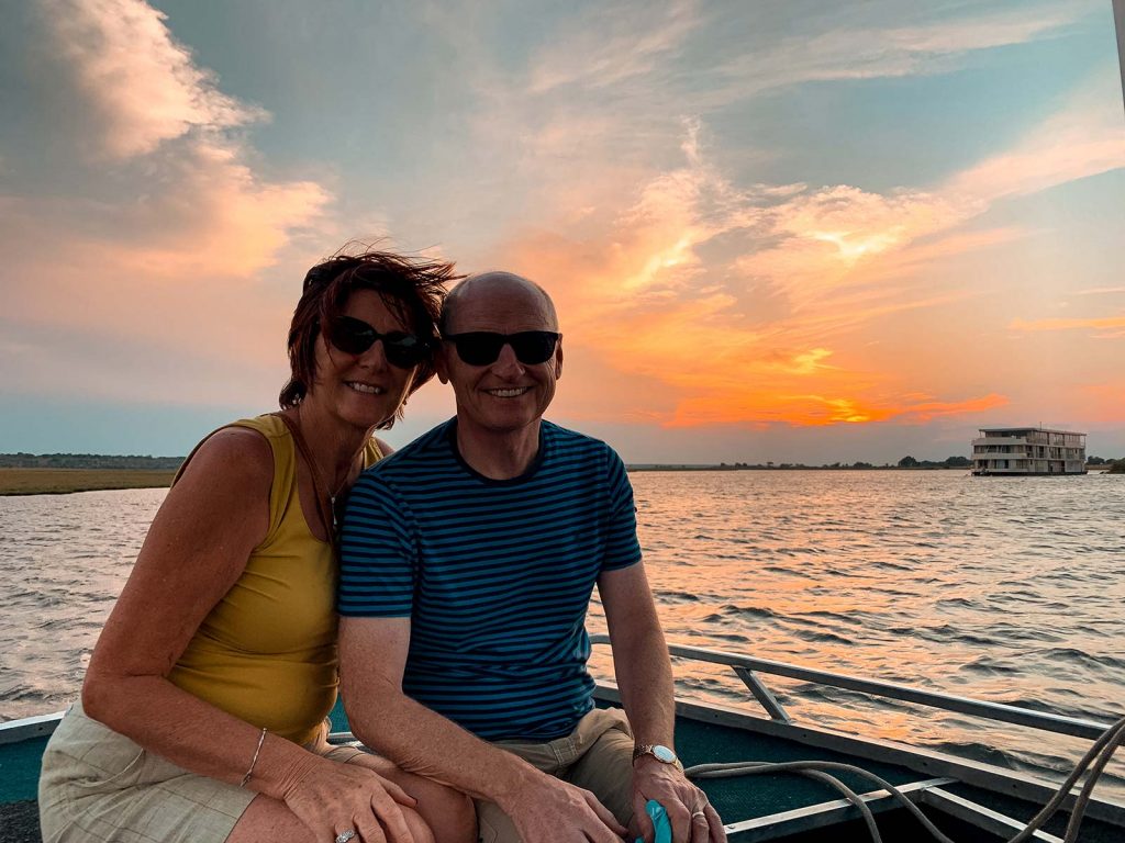 Mom and dad during sunset at Zambezi River in Namibia, Africa. Kasenu Village, Namibia