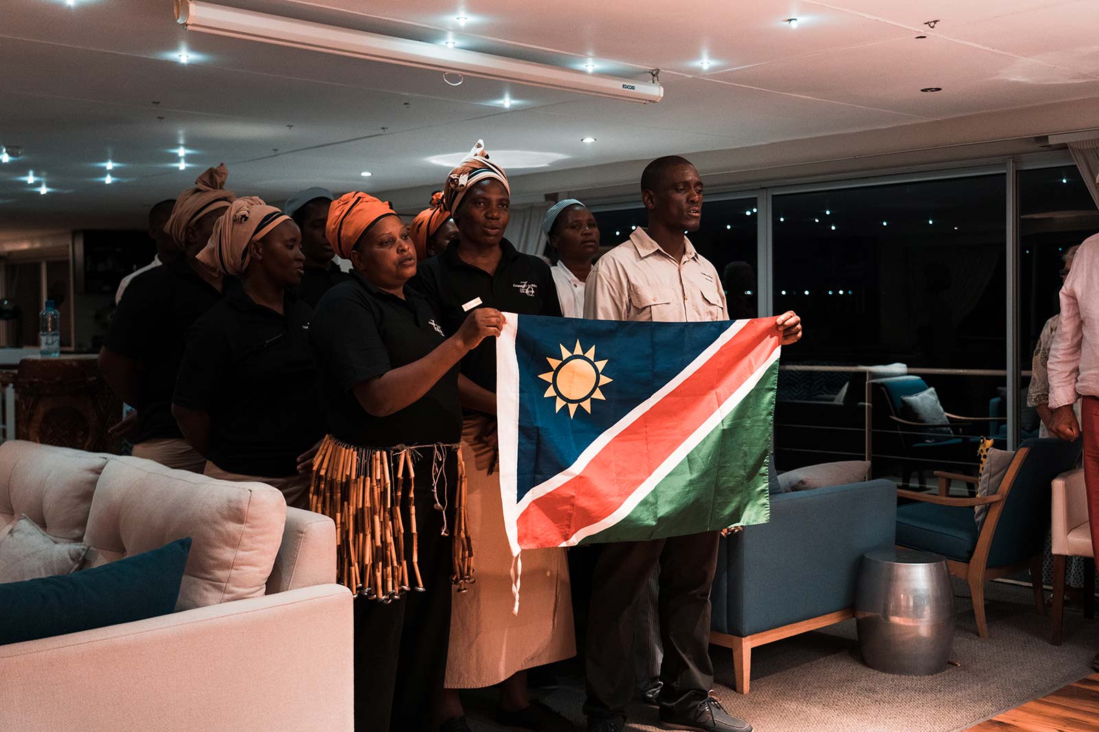 Locals singing their National Anthem at Zambezi Queen in Namibia, Africa. Kasenu Village, Namibia