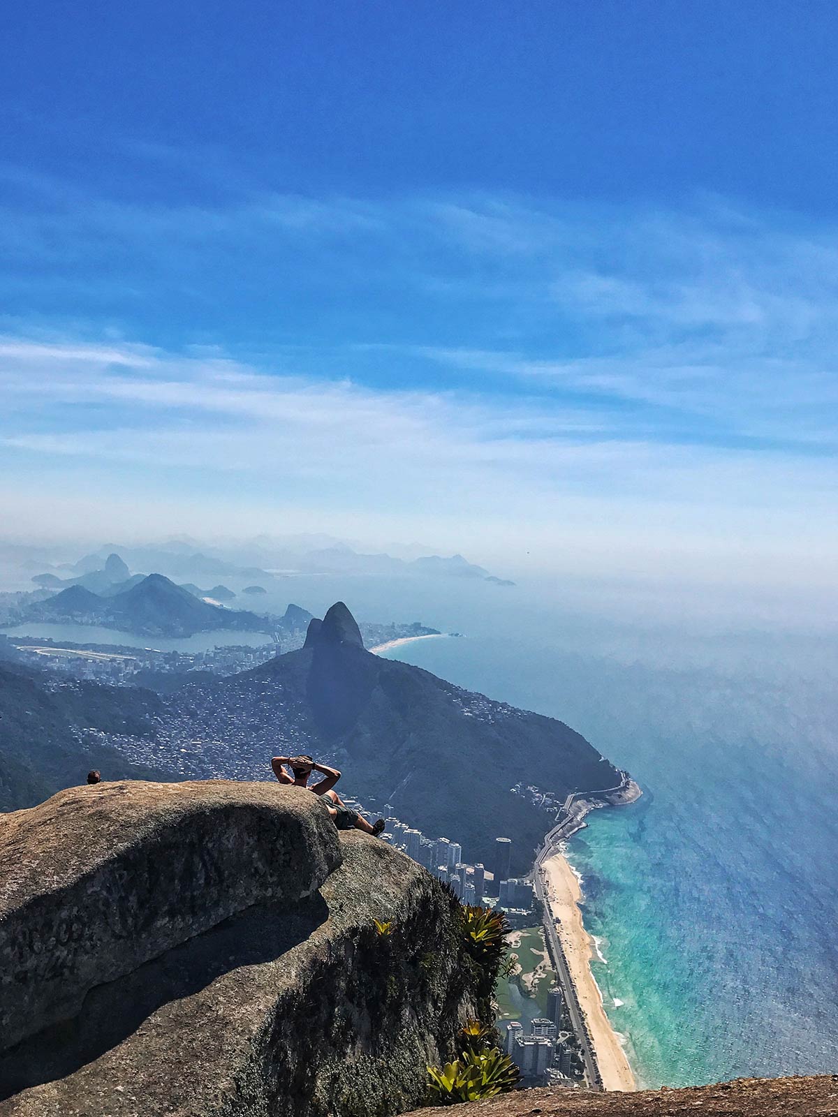 David Simpson seated at the top of the mountain in Gavea, Brazil. Climbing the wrong mountain, the best mistake I've made