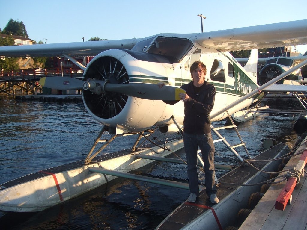 David Simpson standing next to seaplane in Vancouver. Vancouver to Tofino