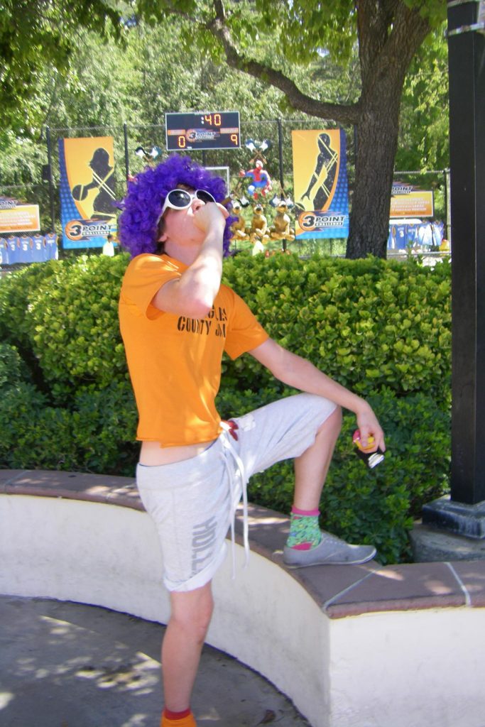 David Simpson wearing a shades and a wig in Los Angeles. LA and Six Flags for free