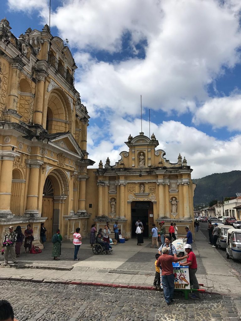 Church and church-goers in Antigua, Guatemala. Volcanic diarrhea in Antigua