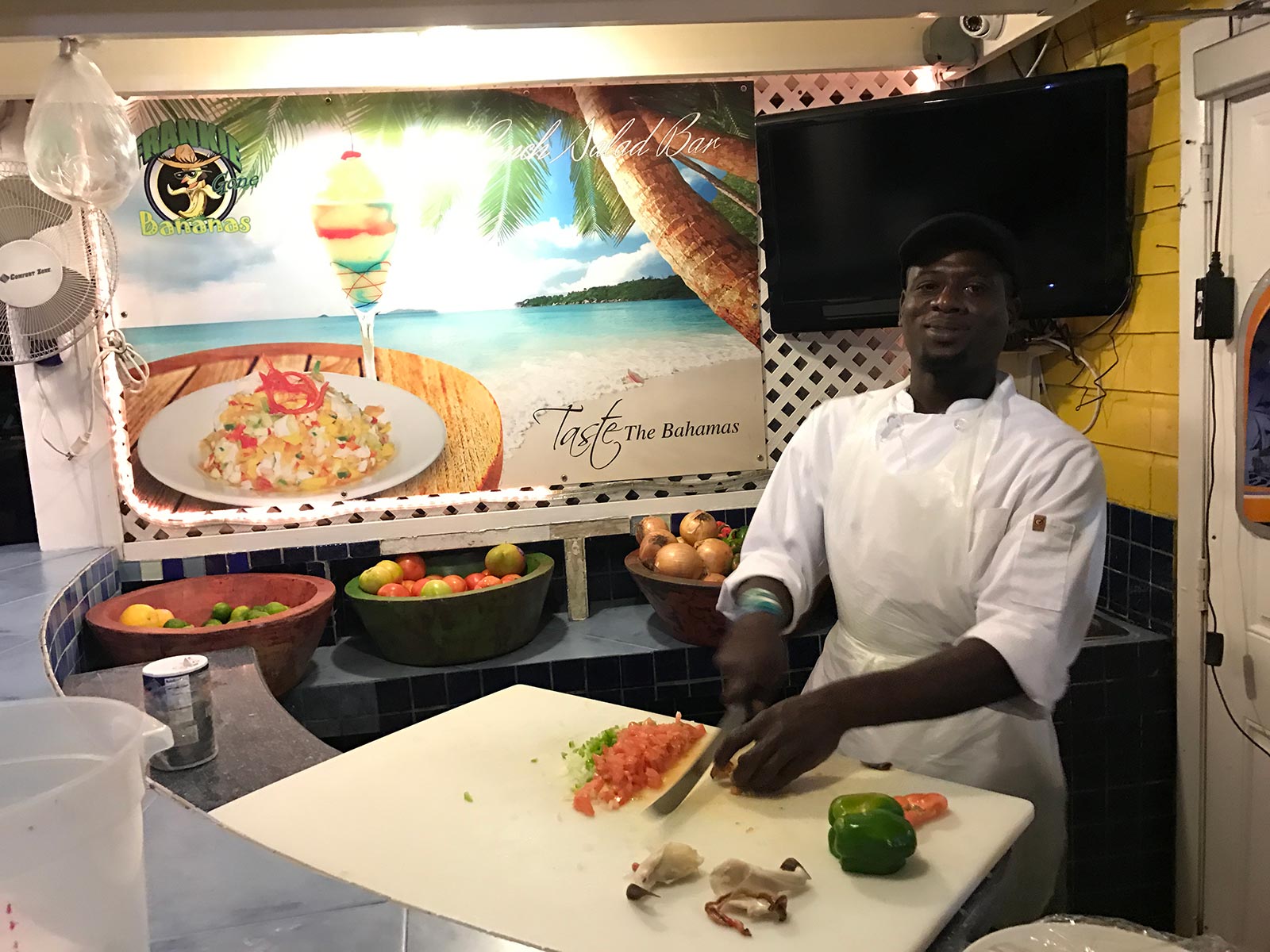 Local cook preparing food in the Bahamas. Diving with sharks in the Bahamas